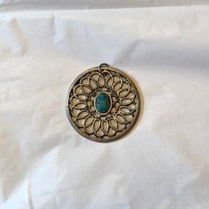 Round silver pendant, with blue stone center
